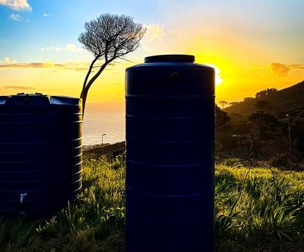 Water tanks moulded from Fenix powder on a hillside at sunset